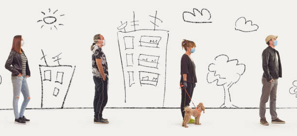 istock People maintaining social distance while waiting in line 1219210531