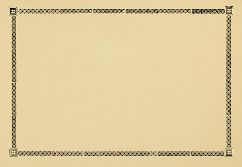 Close up of antique paper texture with border design full frame.