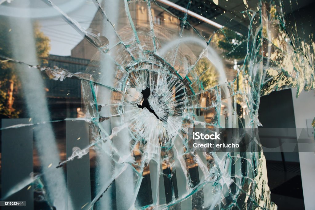 Shop window broken Shop window broken by riots in Chile Riot Stock Photo