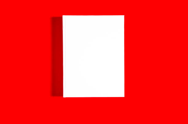 istock Mockup of closed blank square book at white textured paper 1219214612