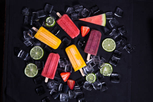 istock Mixed Fruit Popsicle On Iced Black Background Stock Photo 1219214688