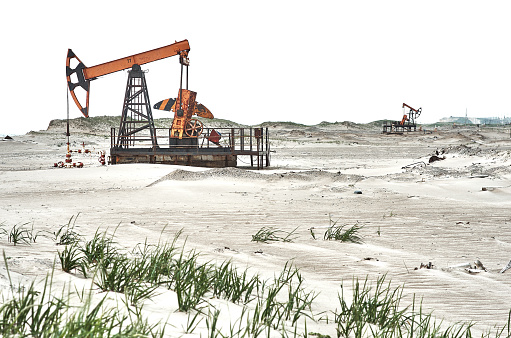 Oil pump, white sky, sand