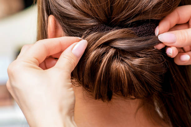 istock Hairdresser makes hairstyle. 1219217172