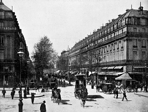 The Boulevard des Italiens in Paris, France. Vintage photo half-tone etching circa mid 19th century.