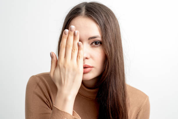 istock Woman covers her face by hand. 1219217550