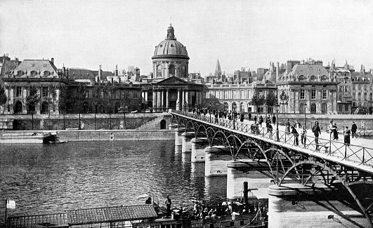 The Institut de France and Pont des Arts bridge in Paris, France. Vintage photo half-tone etching circa mid 19th century.