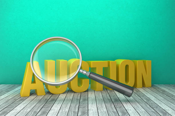 istock 3D Word AUCTION with Magnifying Glass - 3D Rendering 1219221616