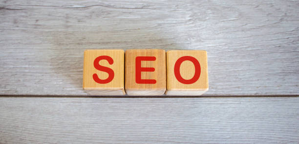 istock Concept word seo on cubes on a beautiful white wooden table. 1219223397