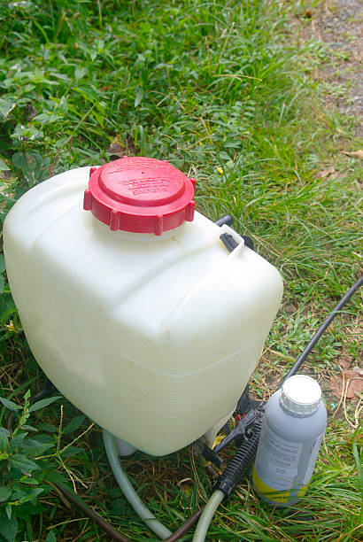 istock crop sprayer and chemical container outdoors 121922421