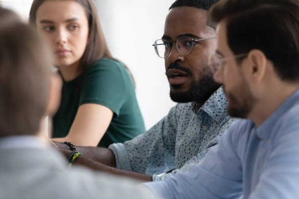 istock Focused multiracial colleagues consider business project at meeting 1219224599