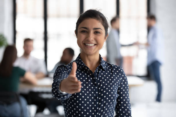 istock Smiling indian recruiter stretch hand welcoming new employee 1219224637