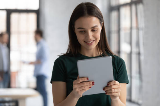 istock Caucasian female employee use modern tablet in office 1219224653