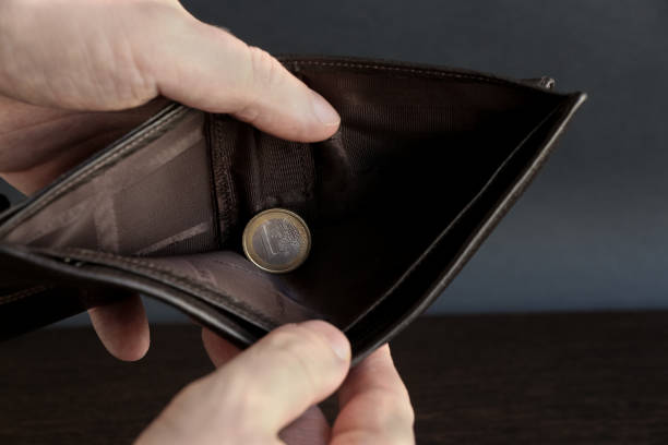 istock nearly empty wallet with one euro coin 1219225704