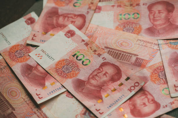One hundred Chinese Yuan cash note background Image of China money 100 Yuan bank note background, business and finance concept. mao original stock pictures, royalty-free photos & images