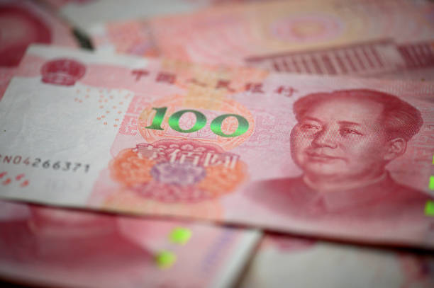 One hundred Chinese Yuan cash note background Image of China money 100 Yuan bank note background, business and finance concept. mao original stock pictures, royalty-free photos & images