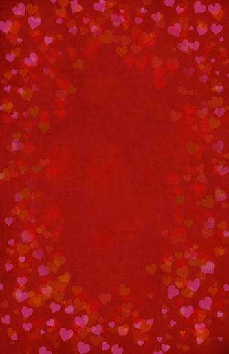 Red defocused bokeh frame with heart shape and space for your text. Can be used as a template for romantic, Valentine's day holiday greeting cards or posters.