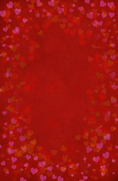 Red background with heart shapes stock photo