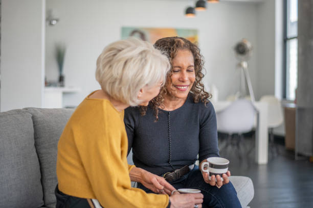 istock Two women visit together 1219227326