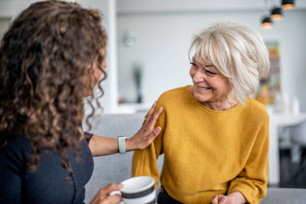 istock Two women visit together 1219227338