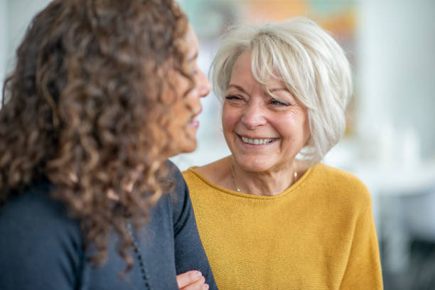istock Two women visit together 1219227387