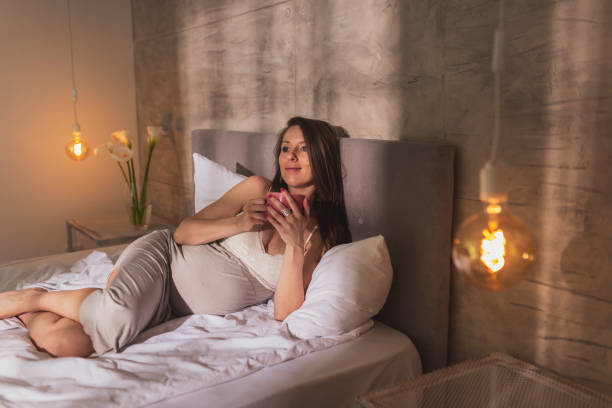 istock Pregnant woman drinking coffee 1219227862
