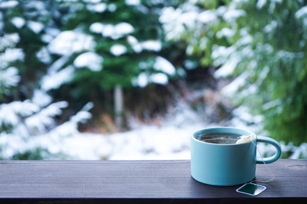 istock Cup of tea on the terrace railing, space for text. 1219229925