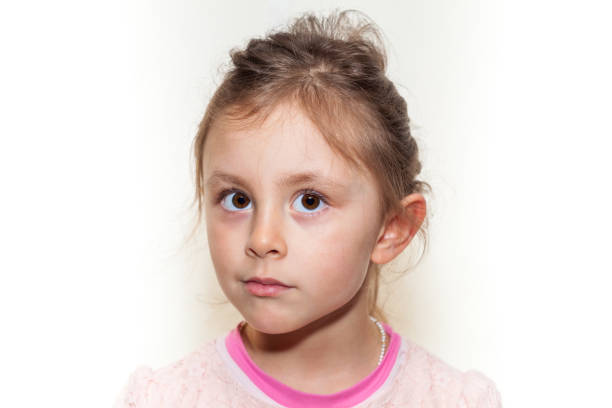 istock Preschool girl with white background looking at camera 1219231168