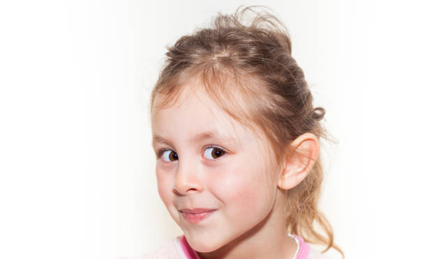 istock Preschool girl with white background looking at camera 1219231239