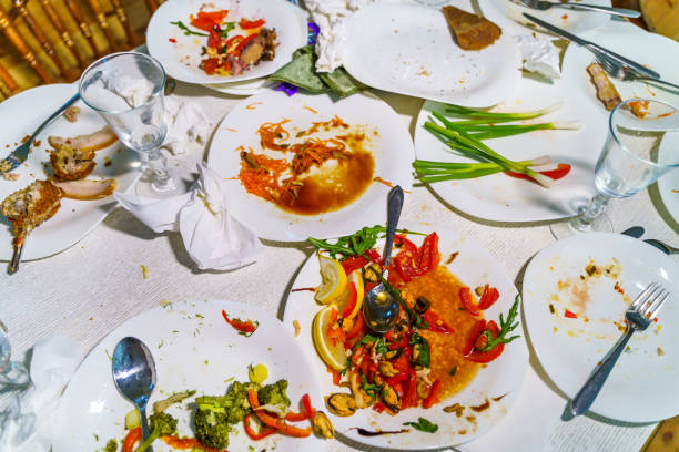 istock Dirty dishes and glasses on the table after eating. 1219231998