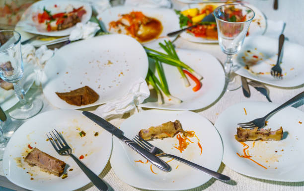 istock Empty dishes after family dinner in restaurant. 1219232048