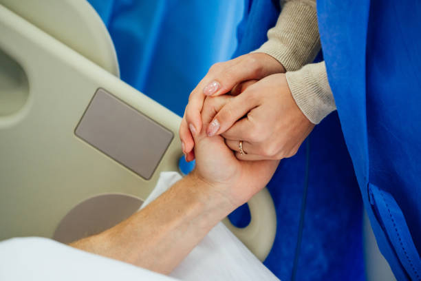 istock Holding patient hands in a hospital. 1219232693