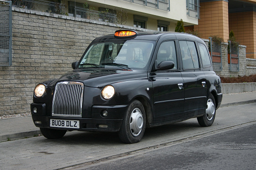 Warsaw, Poland – 11 December, 2009: LTI TX4 (London Taxi Company) taxi stopped on a parking. This vehicle is equipped in special wheelchair ramp on the right side of the car. The LTI TX4 was the most popular taxi vehicle in UK.