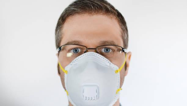 istock Man in medical mask. Place for your text. 1219235663