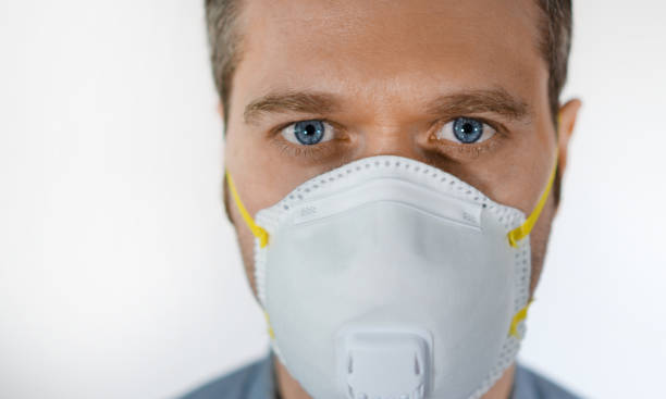 istock Man in medical mask. Place for your text. 1219235667