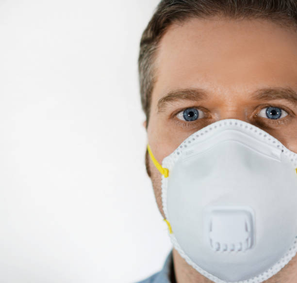istock Man in medical mask. Place for your text. 1219235681