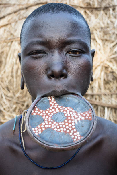 Mursi tribe woman Mago National park, Omo Valley, Ethiopia- March 13 2019: Portrait of a woman from the Mursi tribe, using a lip plate, in Mago National Park, Omo Valley, Ethiopia. omo river photos stock pictures, royalty-free photos & images
