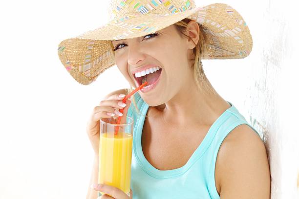 young woman with orange juice stock photo