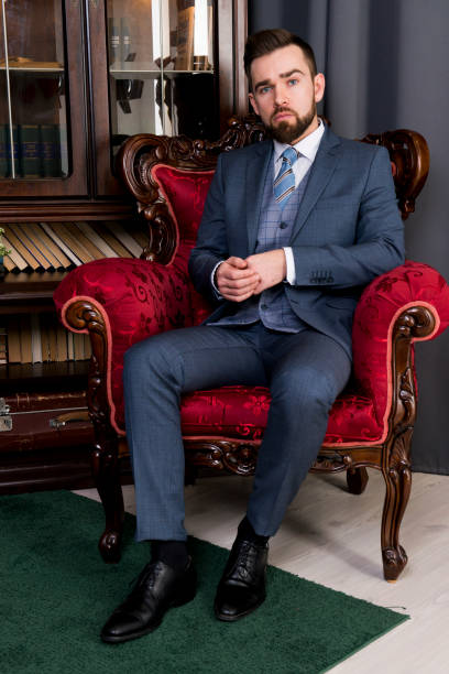 istock Man in fashionable clothes posing in the interior 1219238829