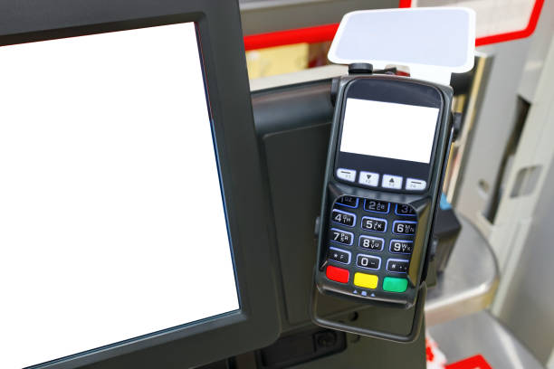 istock Credit card reader or pos terminal with copy space on the screen in a supermarket. 1219239271