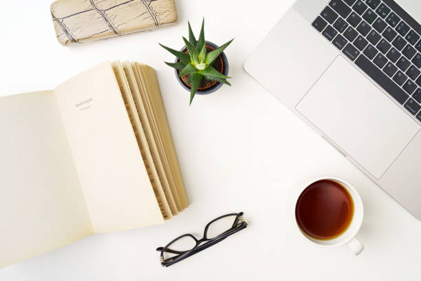 istock Top view flat lay with notebook, cup of coffee, book and succulent 1219240454
