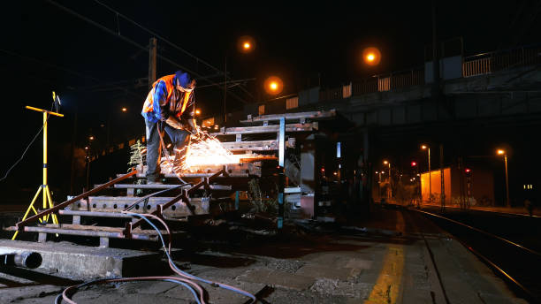 istock Industrial welding. Sparks splashing all over metal construction 1219241849