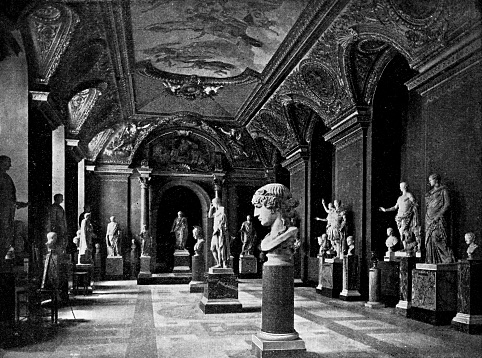 Ancient Greek sculptures at Palais du Louvre in Paris, France. Vintage etching circa mid 19th century.