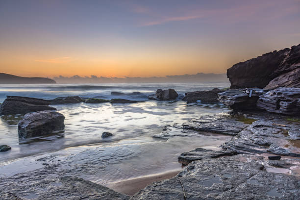 istock Soft Pale Sky Autumn Sunrise by the Sea 1219242764