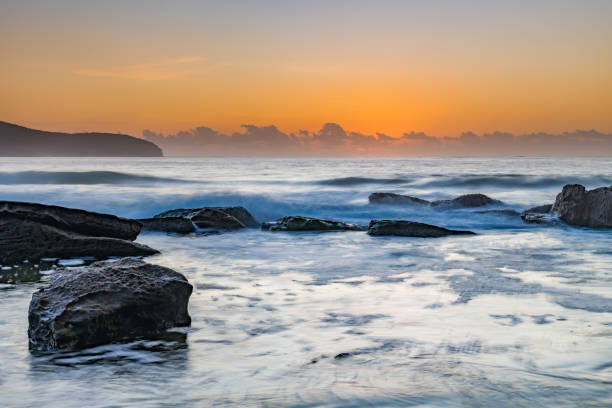 istock Soft Pale Sky Autumn Sunrise by the Sea 1219242809