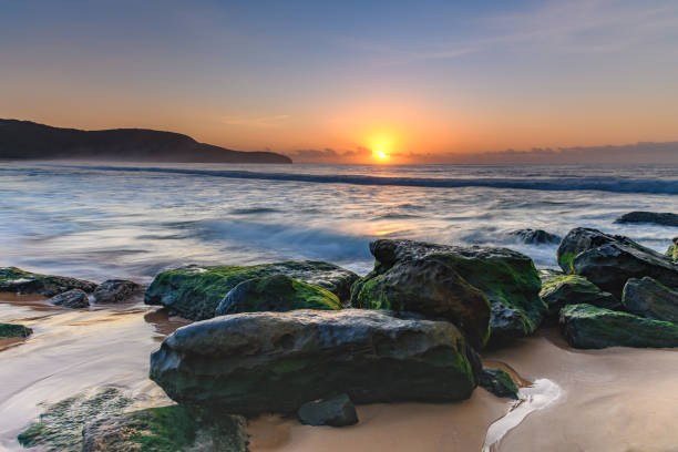 istock Soft Pale Sky Autumn Sunrise by the Sea 1219242828