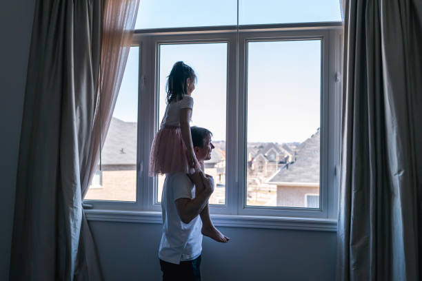 istock Girl Riding on Dad's Shoulders 1219244062
