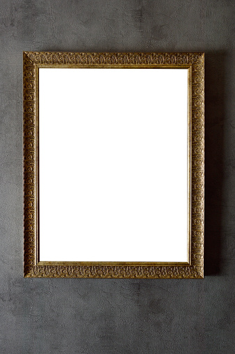 Empty picture frame (clipping path) hanging on wall