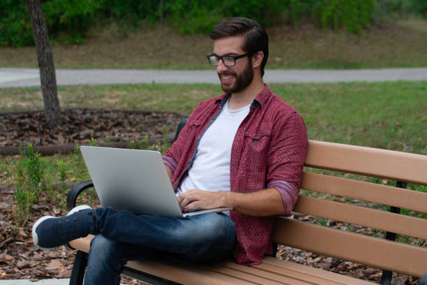 istock A young man working remotely on his laptop 1219246893