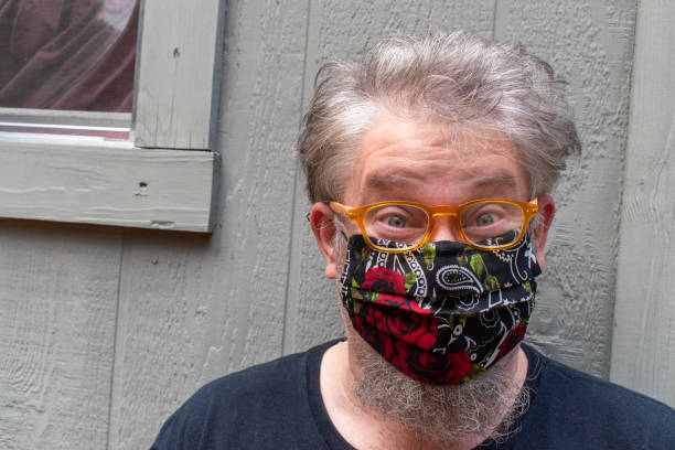 istock man with beard wearing homemade virus protection mask outside 1219248543