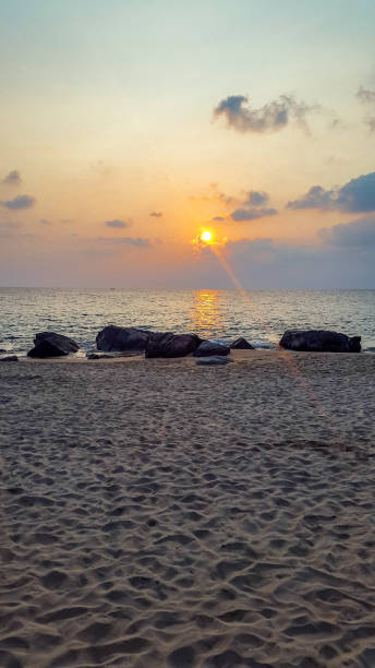 istock Sunset at Laem Singh beach in Phuket, Thailand 1219250564